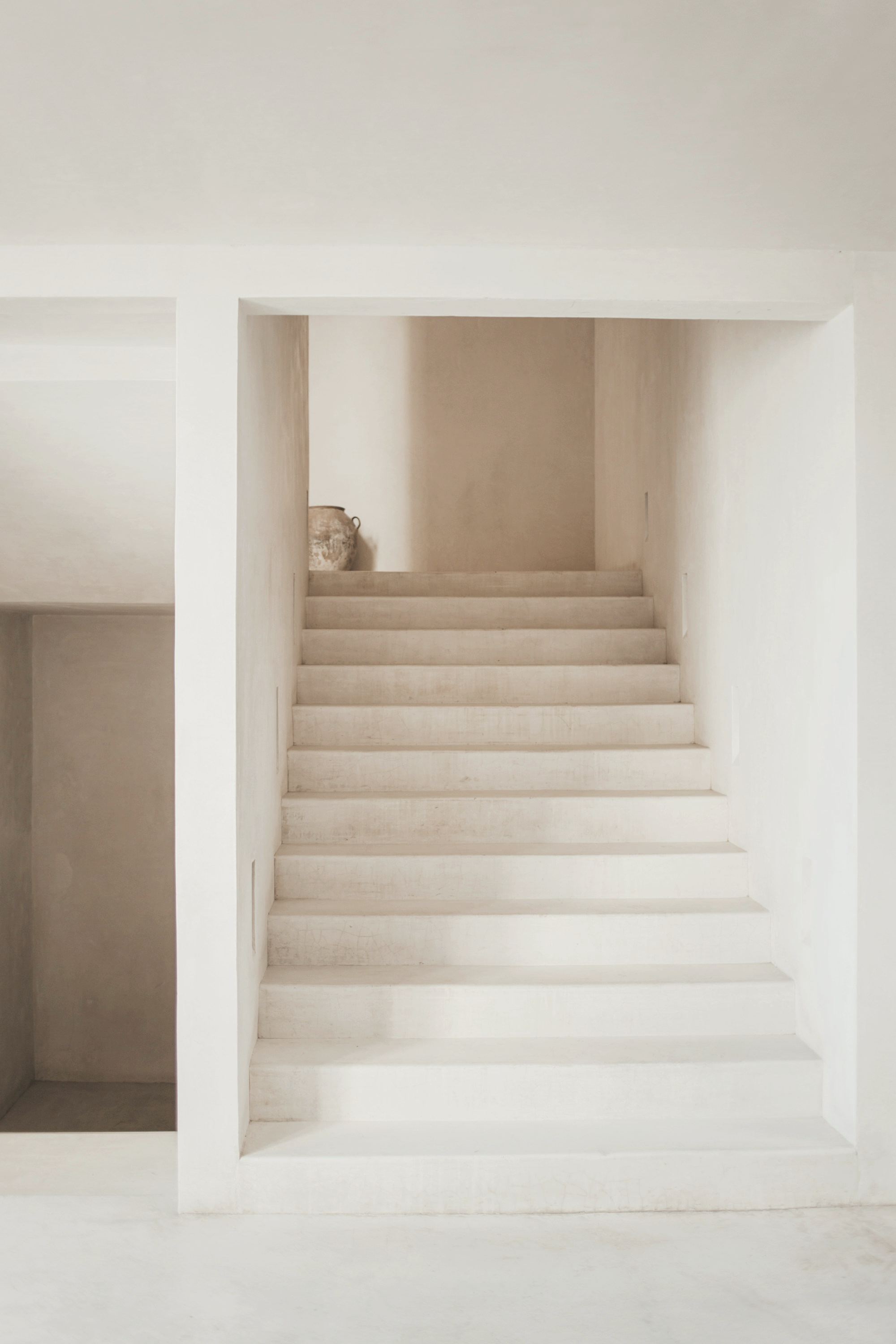 Pale concrete steps rising toward soft daylight